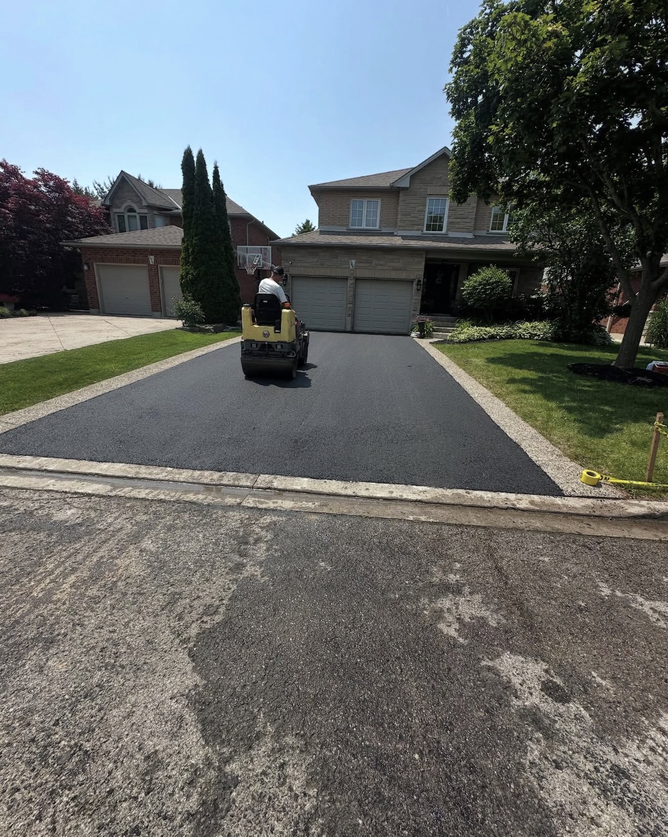 Curved residential driveway asphalt paving project